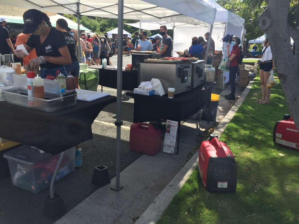 Honda gas generators powering a food stand at a farmer's market in Honolulu, Hawaii. Photo by Alexander Boom.