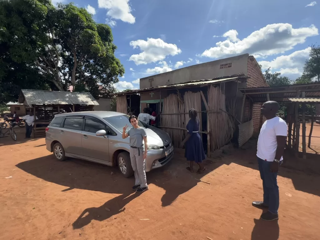 Phillip of Neza Expeditions with his car and tour guests.